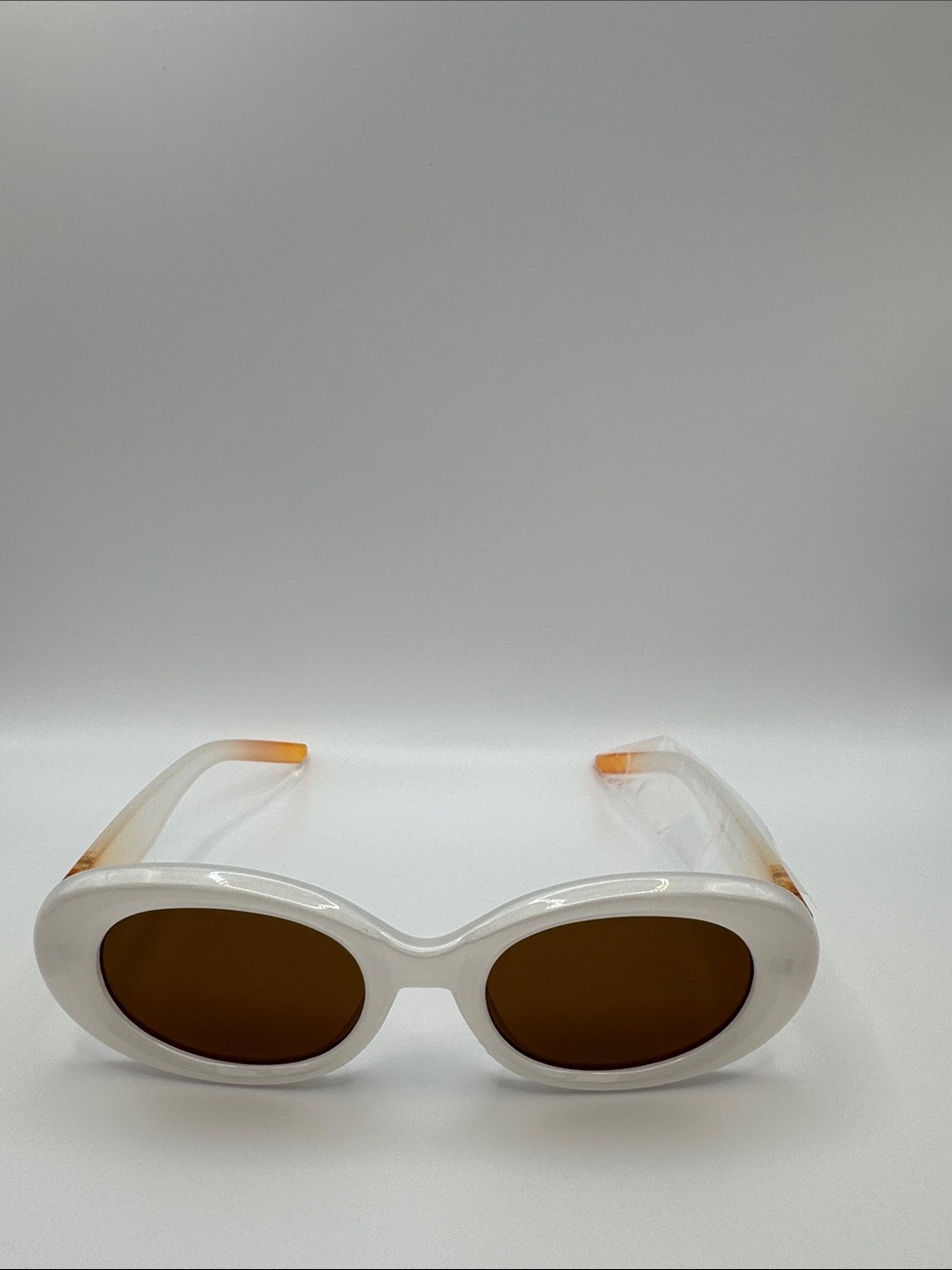White Oval Frame Sunglasses with Brown Lenses